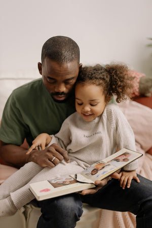 Father reading to daughter, gifts for dads, fathers, grandfathers and more